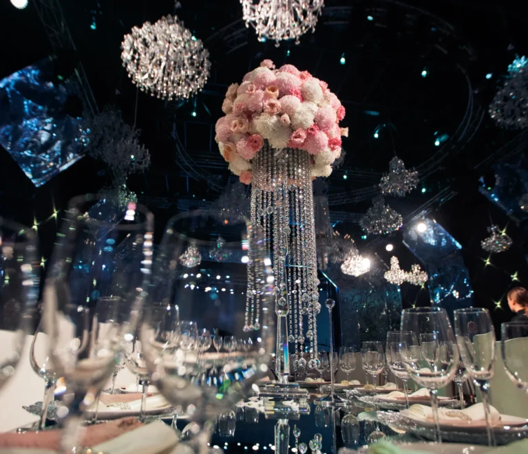 tall-centrepiece-made-pink-flowers-crystal-chains-stands-dinner-table